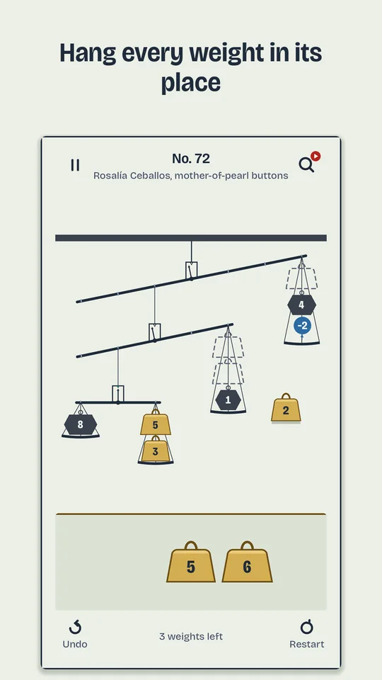 Order 72: a mobile of four scales with brass weights, iron weights and a balloon, and two weights on the counter.